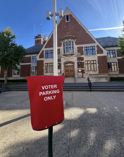 Voter parking sign outside Birmingham Municipal Building, 151 Martin St., on primary election day.