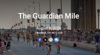 Runners racing across Cleveland's Hope Memorial Bridge during the Guardian Mile, with spectators lining both sides of the road.